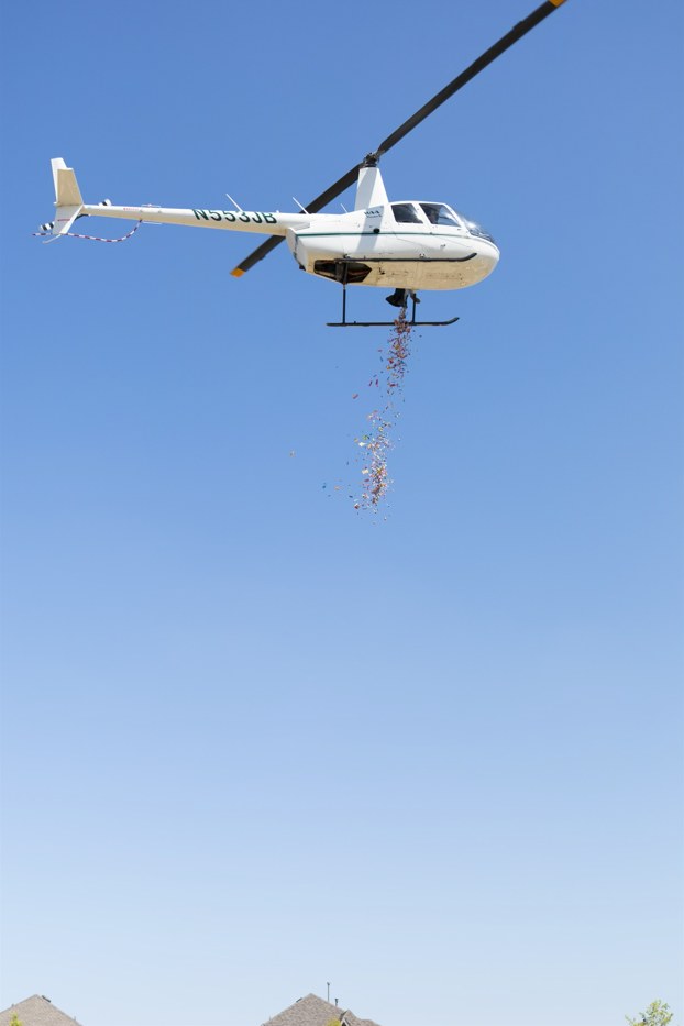 Robinson R-44 making a drop